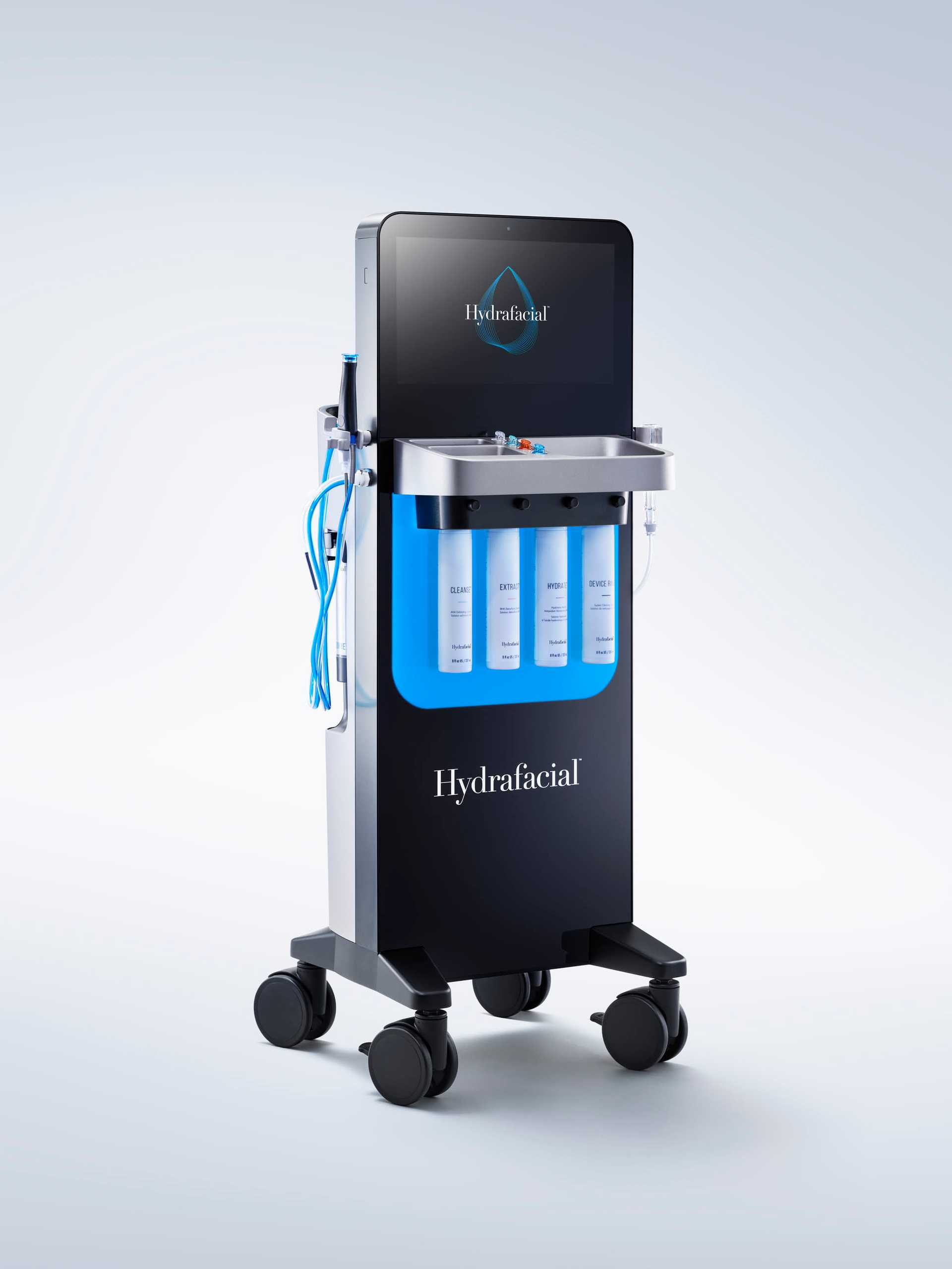 HydraFacial machine with blue product containers and a screen on wheels.